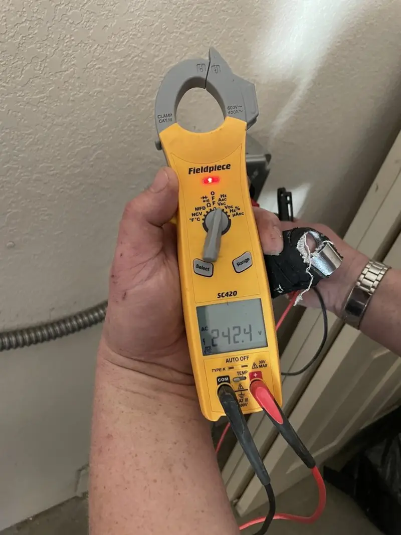 Voltage testing with clamp meter during Recessed Lighting Installation in Adairsville